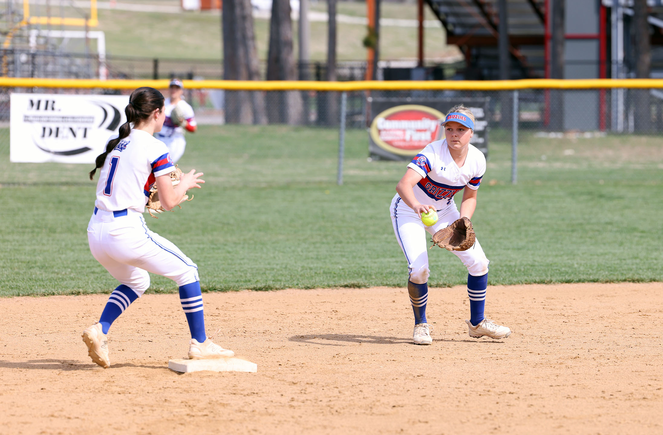 Grizzly second baseman Zoey Williams tosses the ball to shortstop Kenzie Massey to force an out during Tuesday&rsquo;s game against State Fair Community College. (MSU-WP Photo)